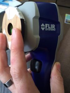 Camera with lens held in place